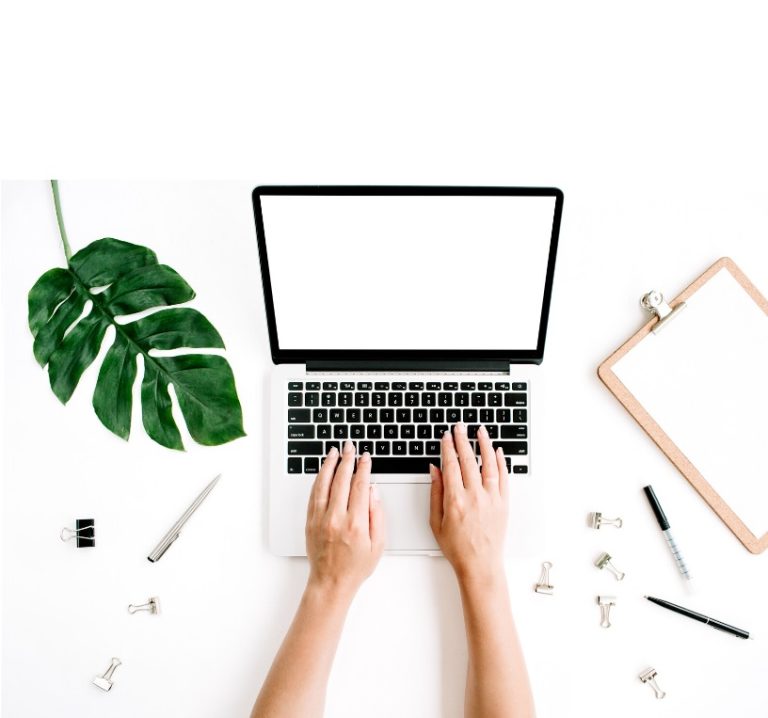 Computer technician troubleshooting laptop software problems in a repair center